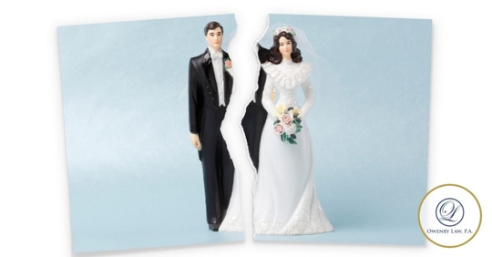 Photograph of a bride and groom wedding topper torn down the middle between the bride and groom.